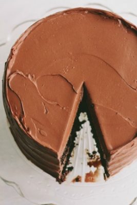 chocolate cake on clear cake stand