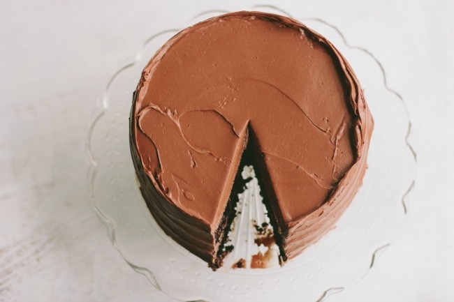 chocolate cake on clear cake stand