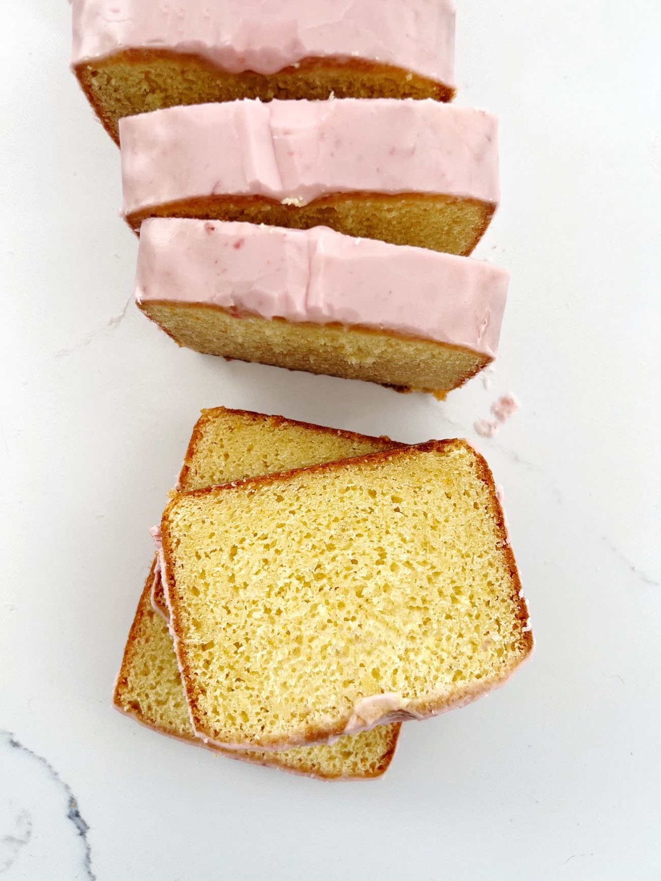 blood orange cake with icing on marble