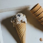 fig and coffee no churn ice cream in a waffle cone