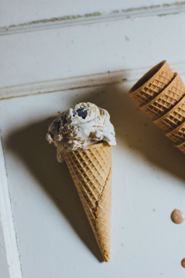 fig and coffee no churn ice cream in a waffle cone