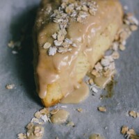 maple oatmeal scones on a piece of parchment paper