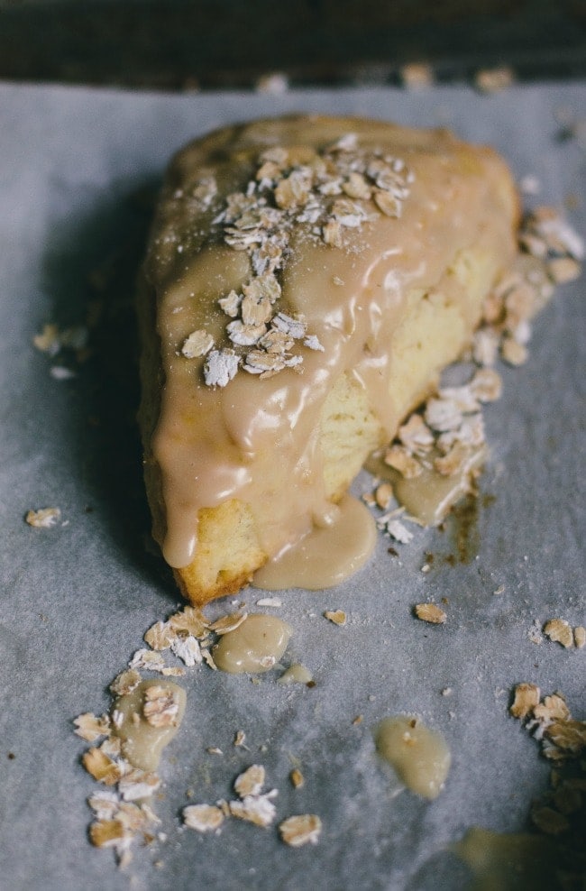 maple oatmeal scones on a piece of parchment paper