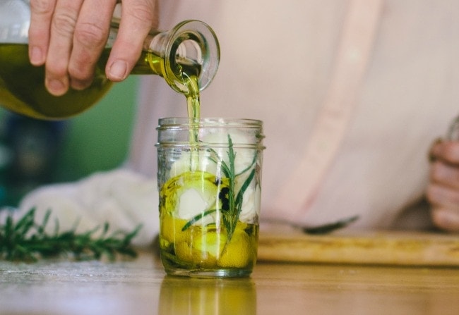 Pouring Olive Oil Into Jar With Lemon and Cheese | Sarah Kieffer | The Vanilla Bean Blog