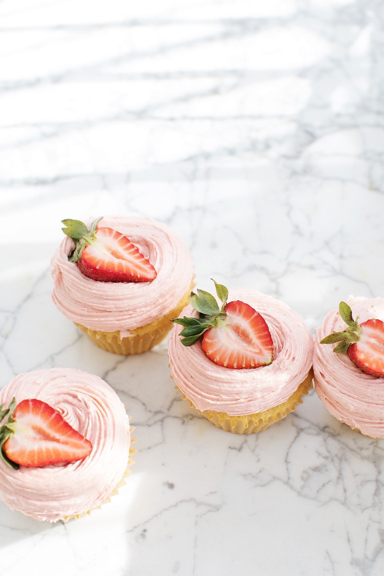 Yellow Cupcakes with Strawberry Buttercream