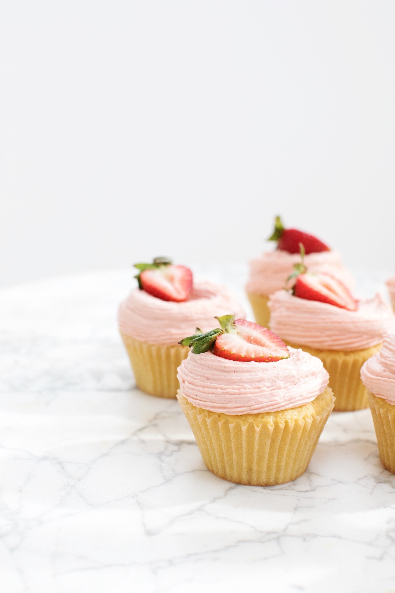 Yellow Cupcakes with Strawberry Buttercream