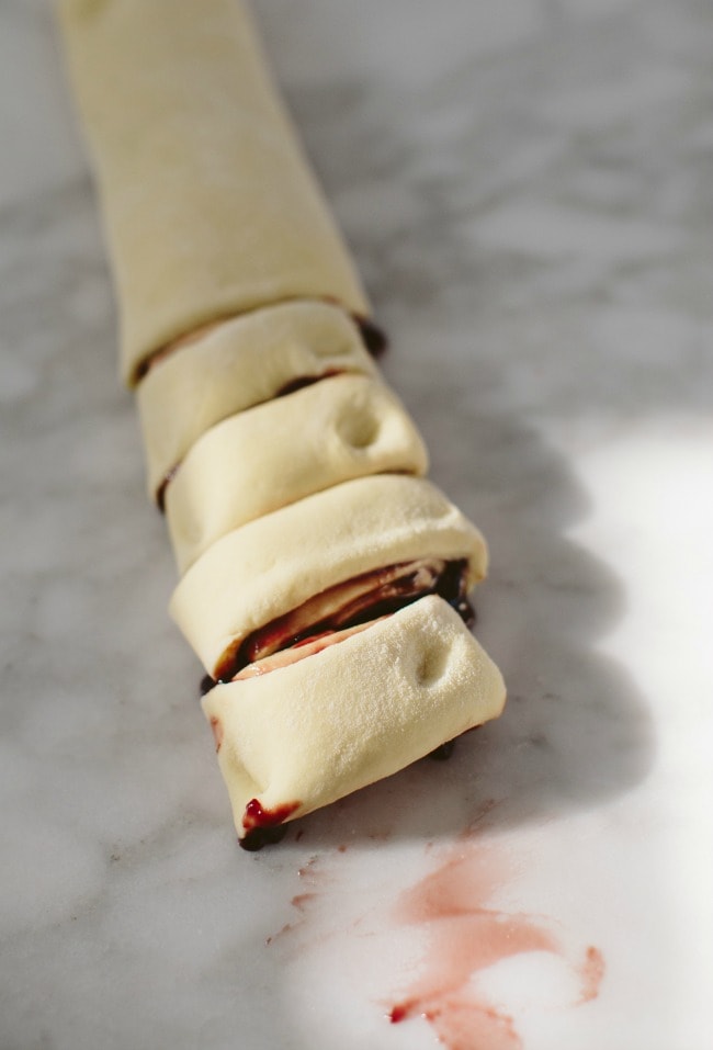 Slicing Blackberry Jam Bun Dough | Sarah Kieffer | The Vanilla Bean Blog