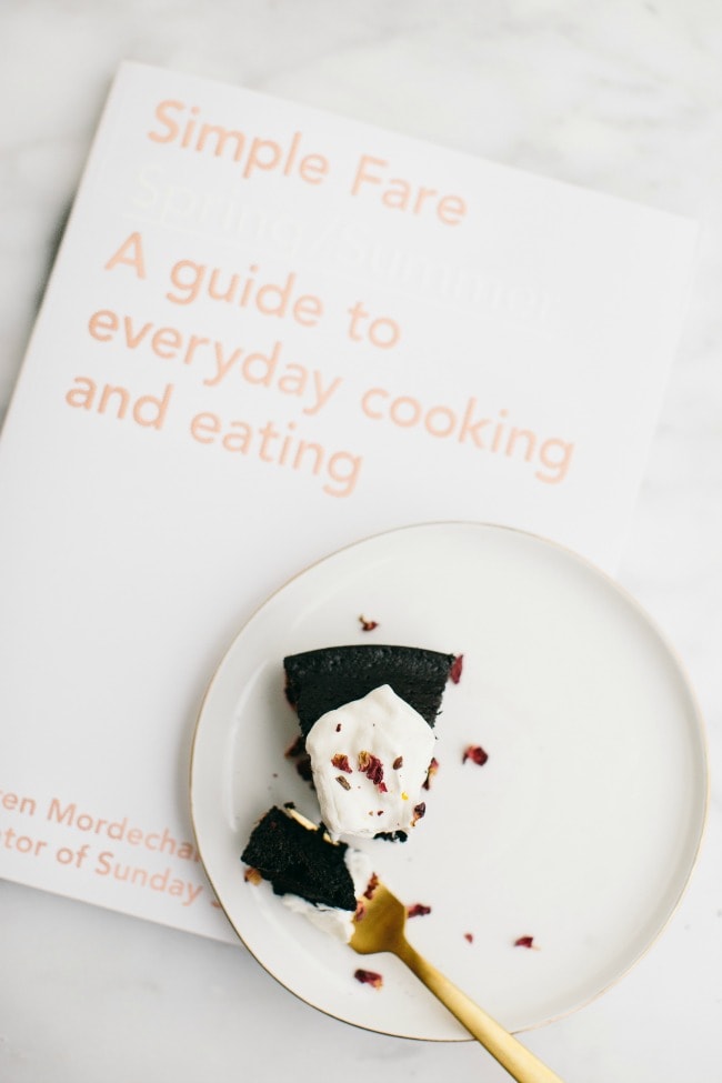 Simple Fare Cookbook with a slice of chocolate olive oil cake