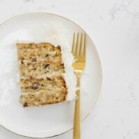 coconut almond cake slice on white plate