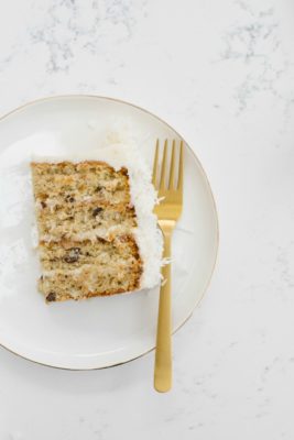 coconut almond cake slice on white plate