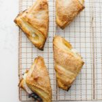 Flaky Turnovers on a wire cooling rack.