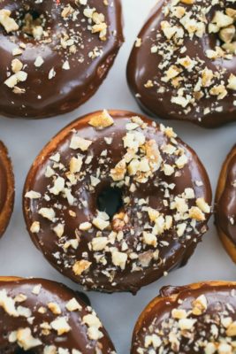 Raised Donuts with Chocolate Glaze and Candied Walnuts