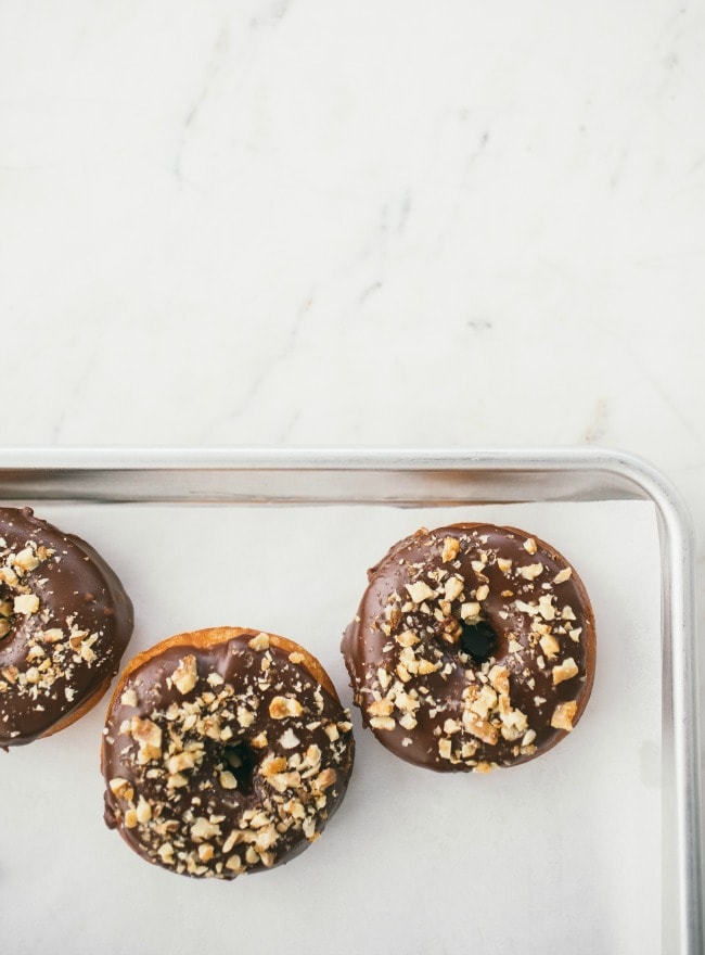 Raised Donuts with Chocolate Glaze and Candied Walnuts