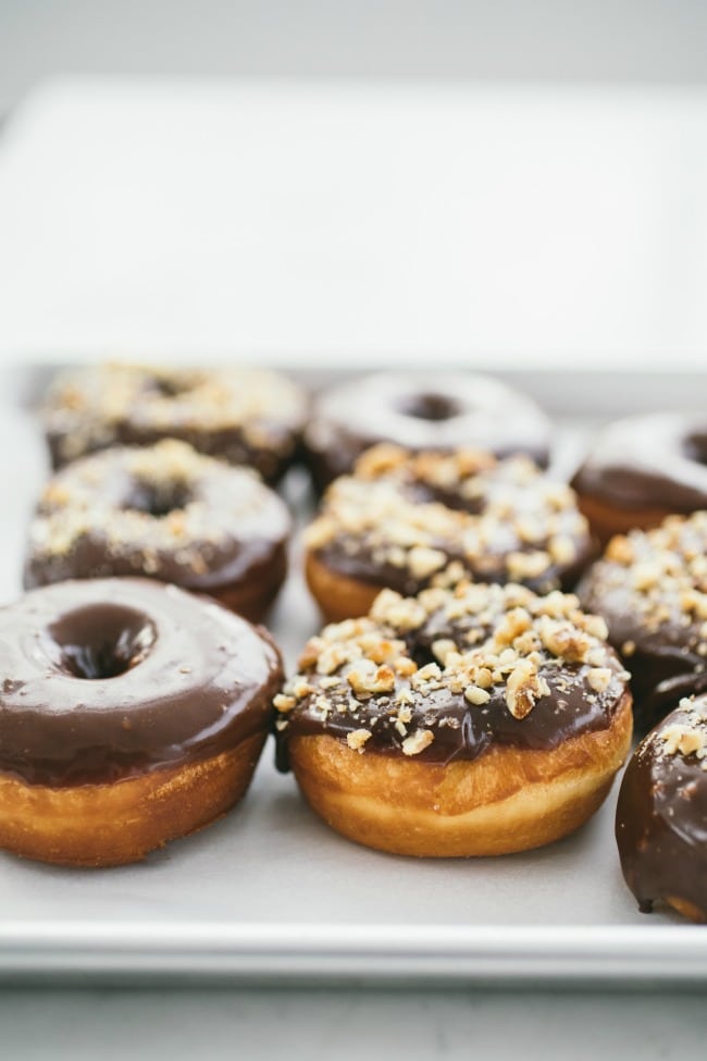 Raised Donuts with Chocolate Glaze and Candied Walnuts