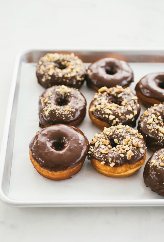 Raised Donuts with Chocolate Glaze and Candied Walnuts