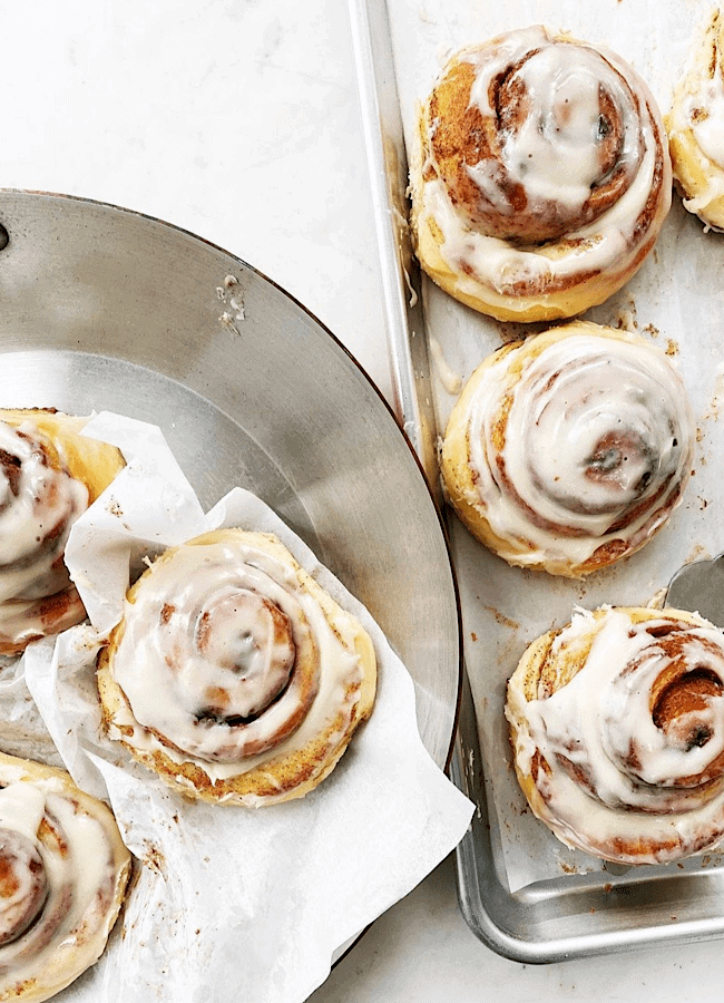 soft and gooey cinnamon rolls on parchment paper
