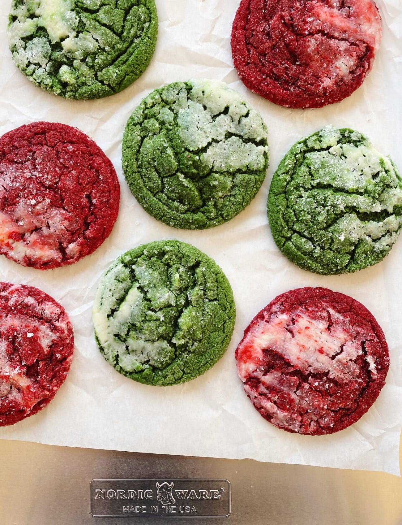 red velvet crinkle cookies on parchment paper