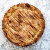 hard cider caramel apple on marble surface. pie