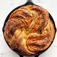 deep dish pizza bread in a cast iron skillet