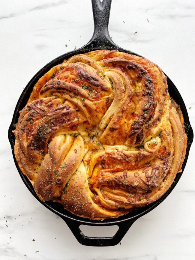 deep dish pizza bread in a cast iron skillet
