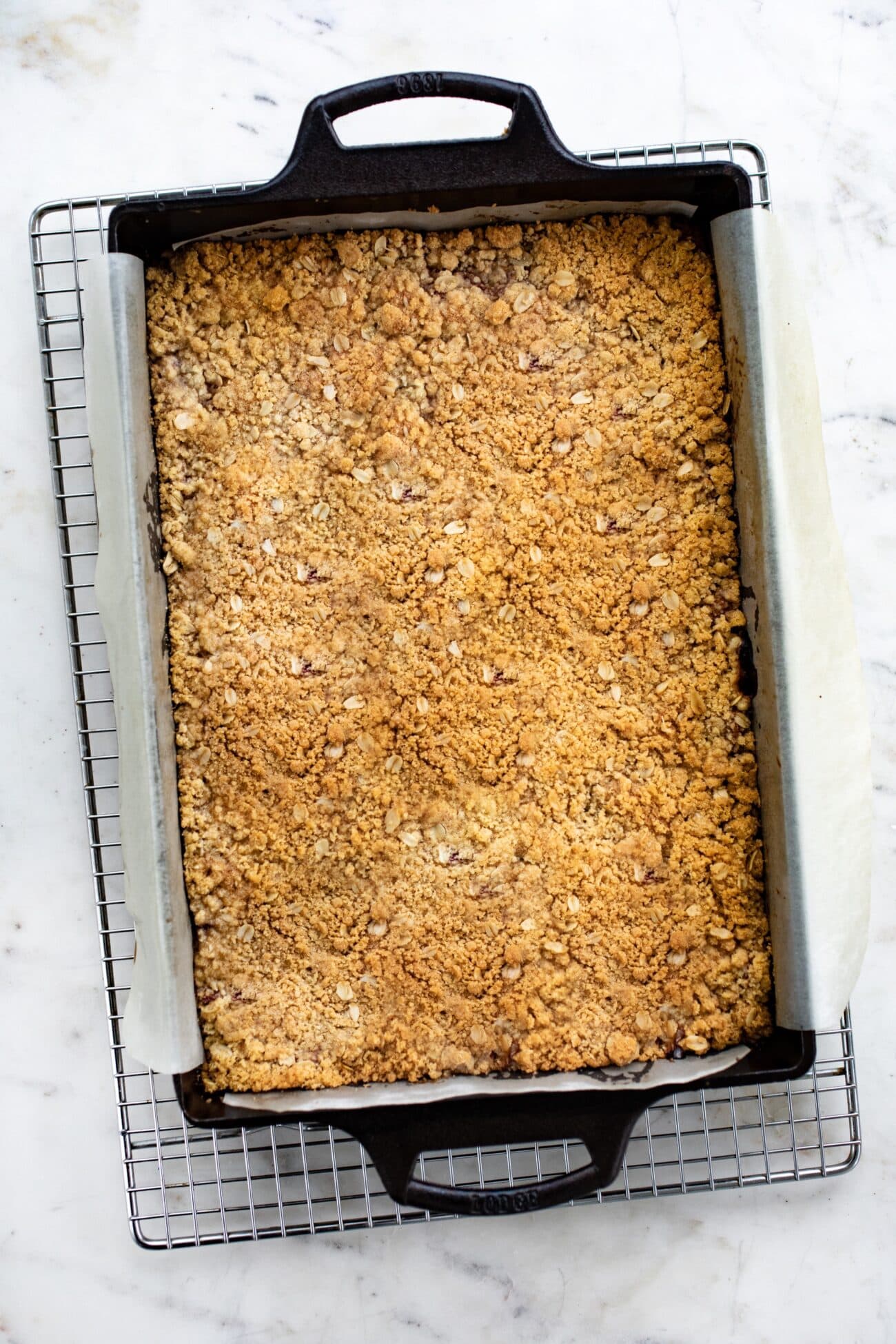 rhubarb pie bars in a cast iron baking pan