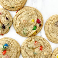 m&m cookies on white parchment