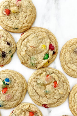 m&m cookies on white parchment
