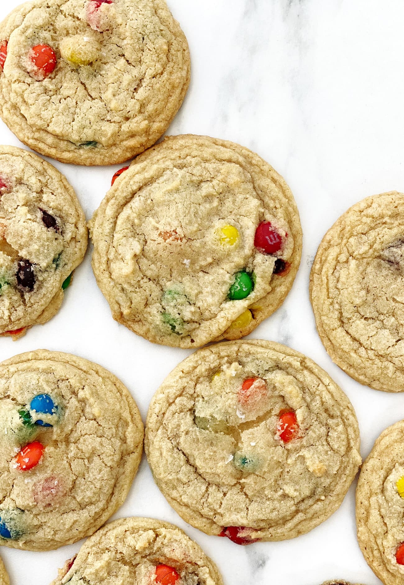 m&m cookies on white parchment