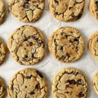 chocolate chip cookies on parchment paper in rows