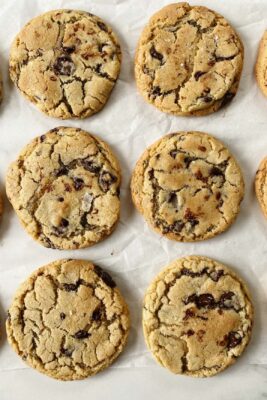 chocolate chip cookies on parchment paper in rows