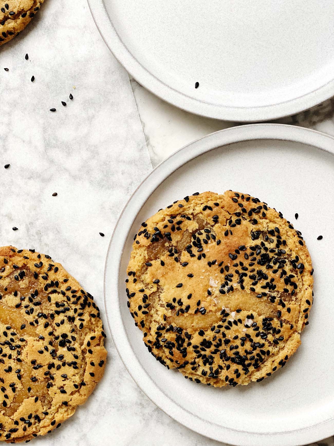 brown sugar toasted sesame cookies on white plates