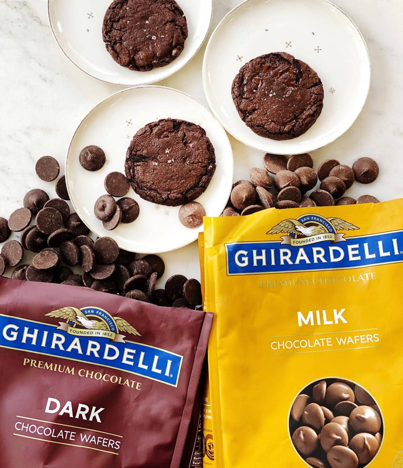 chocolate cookies with bags of ghirardelli chocolate wafers