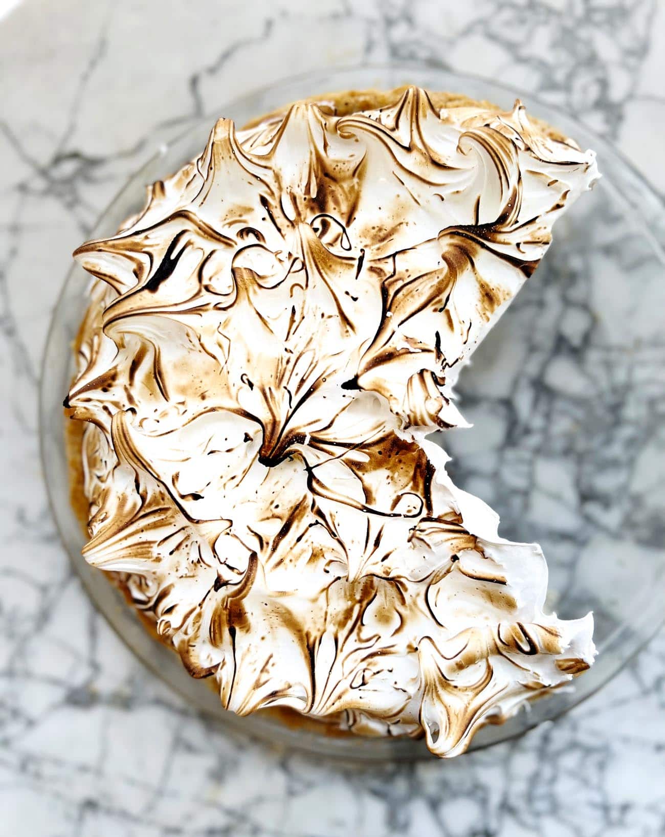 chocolate meringue pie on marble board