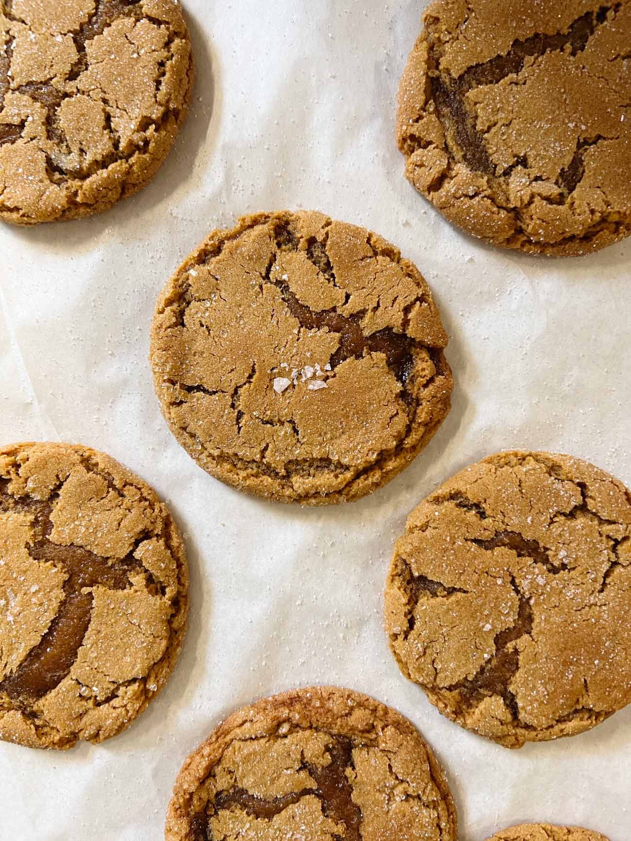 ginger molasses cookies on parchment paper