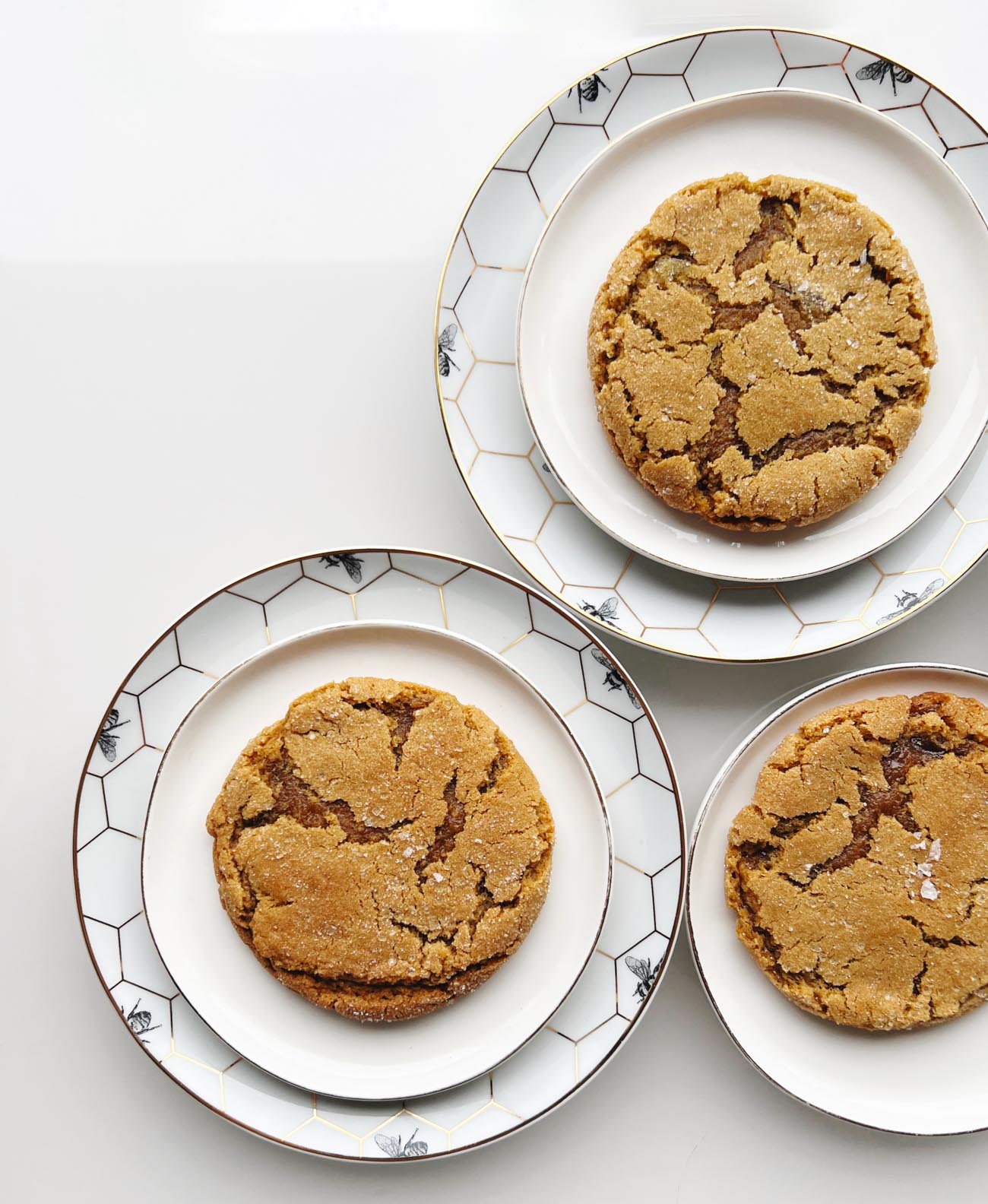 ginger molasses cookies on white plates