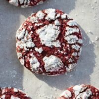 red velvet crinkle cookies on parchment paper