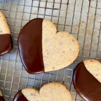 chocolate dipped cacao nib cut out hearts on wire rack