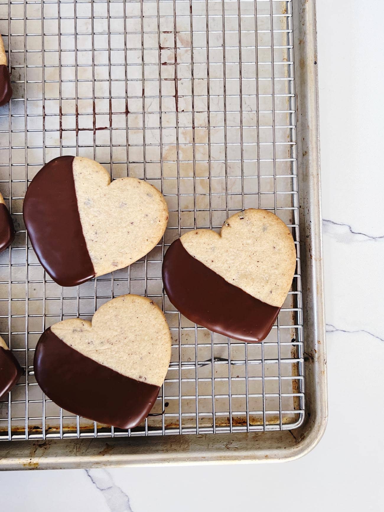 chocolate dipped cacao nib cut out hearts on wire rack