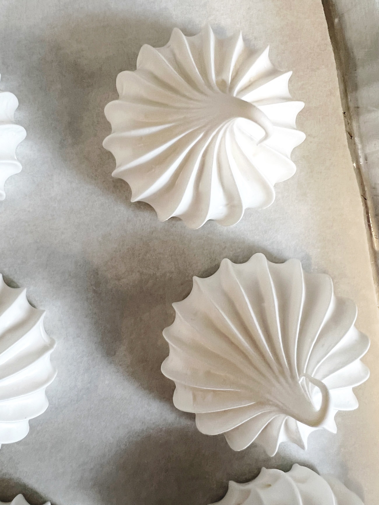 meringue cookies on parchment