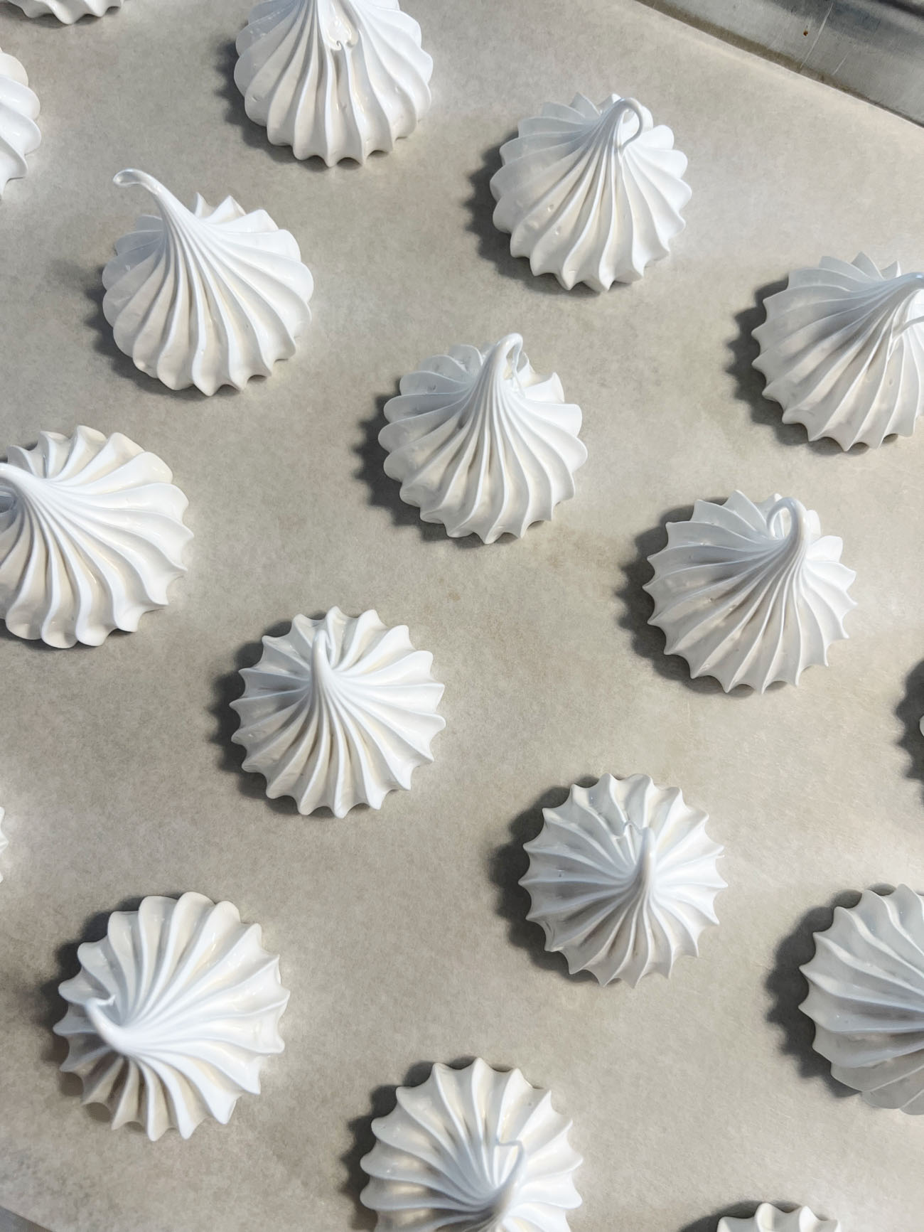 meringue cookies on parchment paper