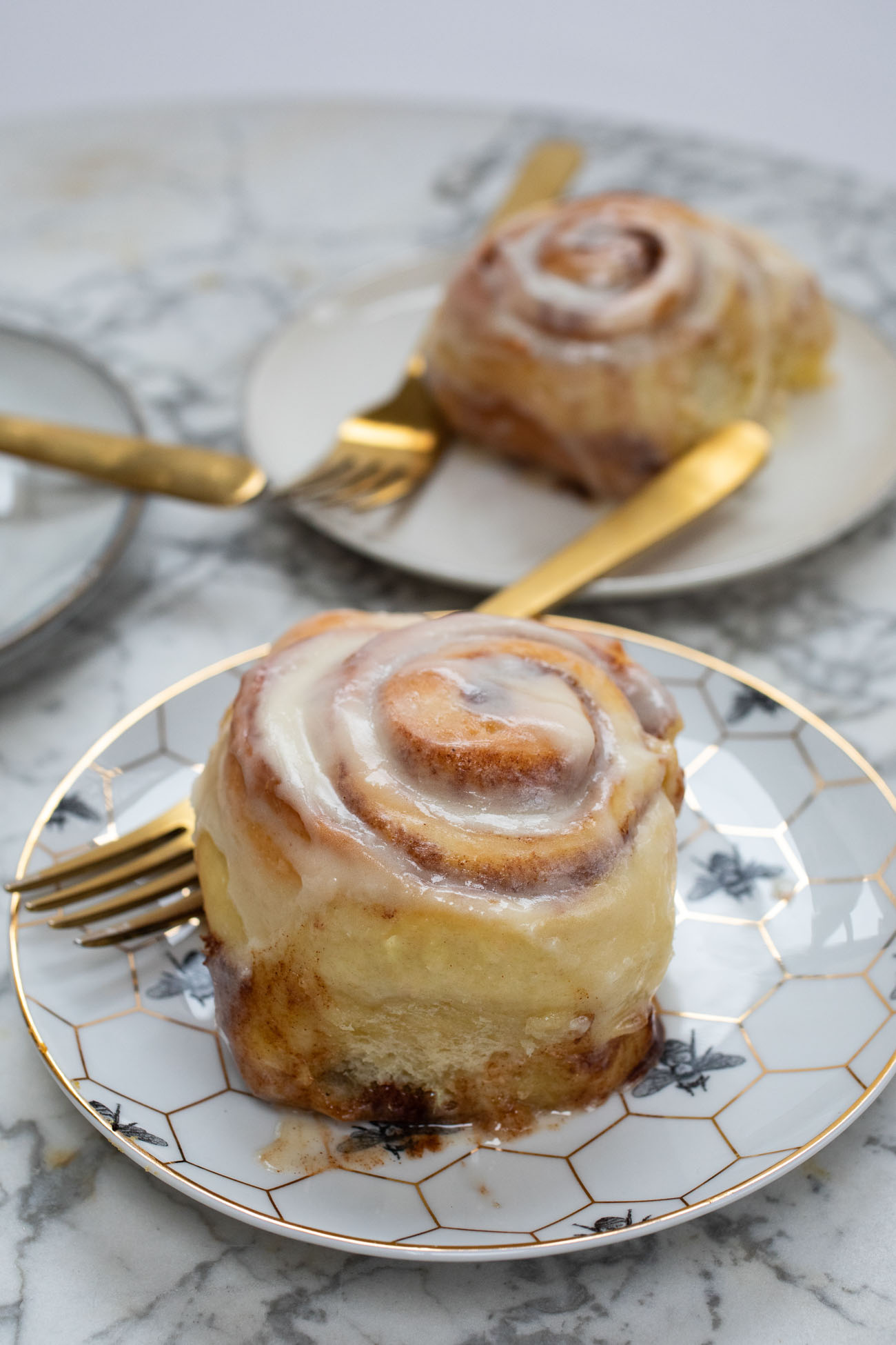 buttermilk cinnamon rolls on plates