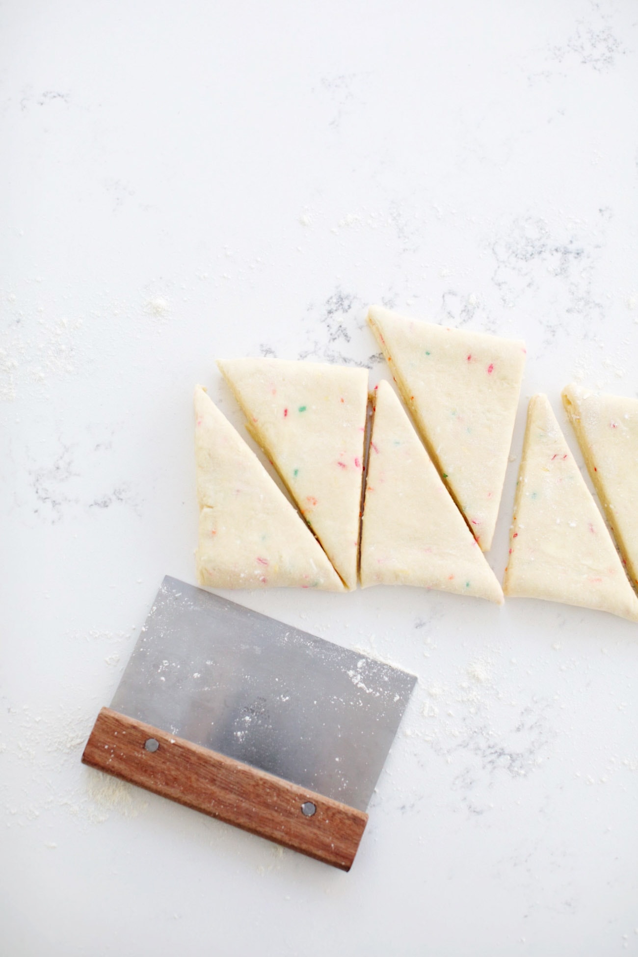 cutting scones using a bench scraper