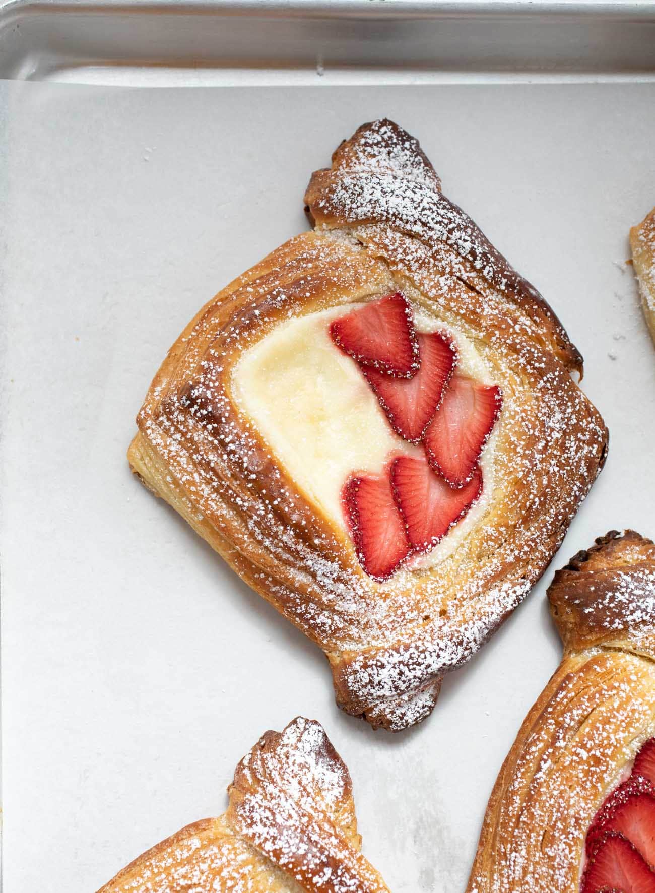 cream cheese danish on parchment paper