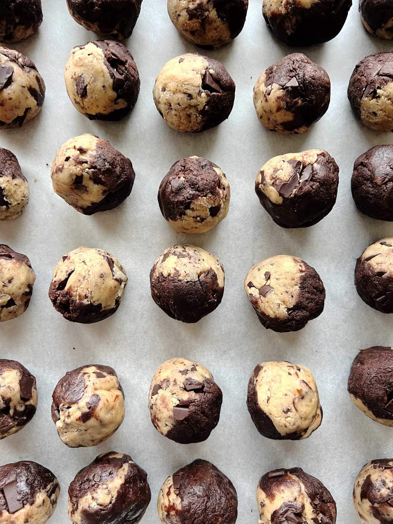 cookie dough balls on baking sheet