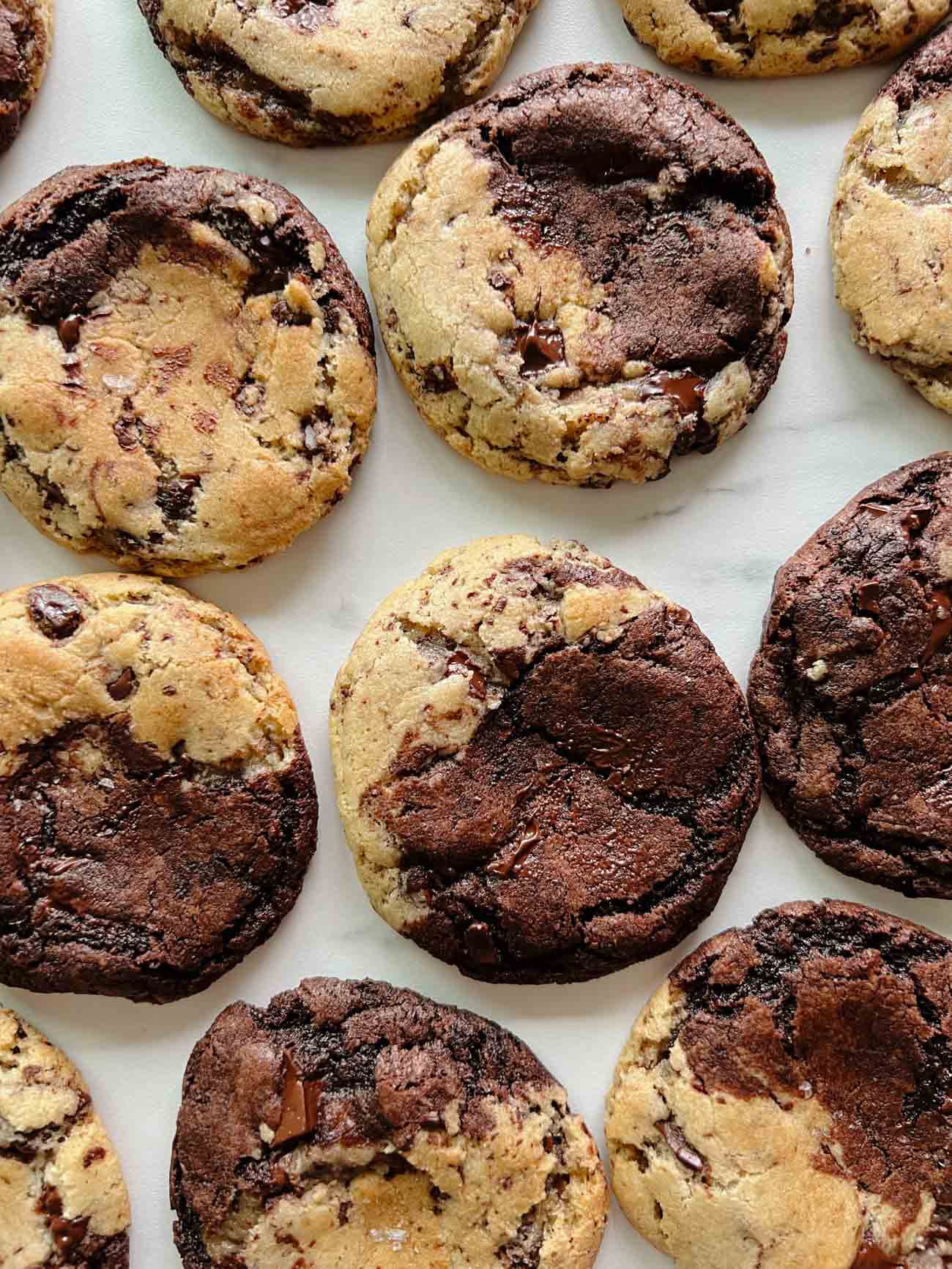 half and half chocolate chocolate chip cookies on marble board