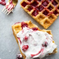 cranberry syrup on waffles with whipped cream