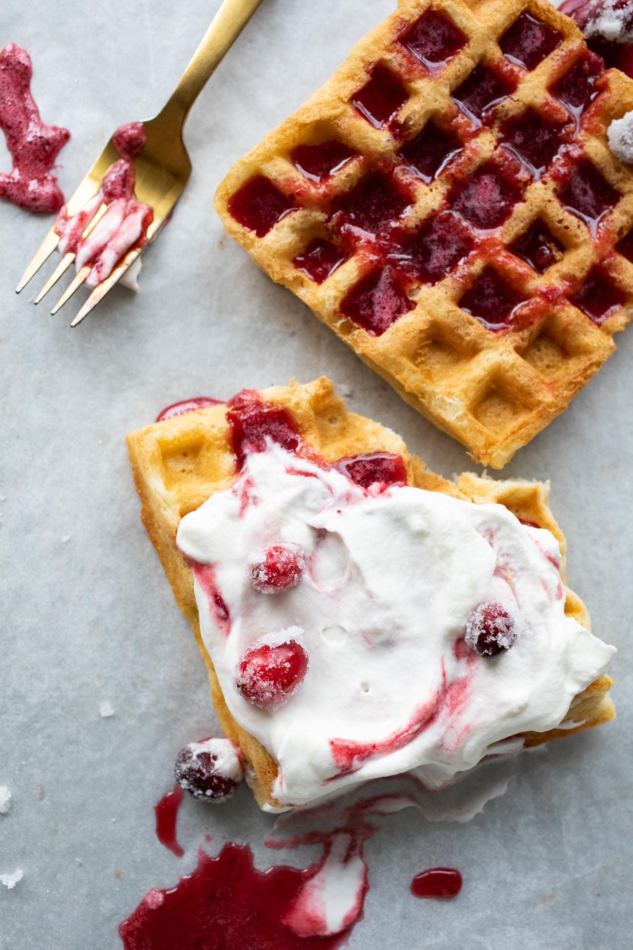 cranberry syrup on waffles with whipped cream