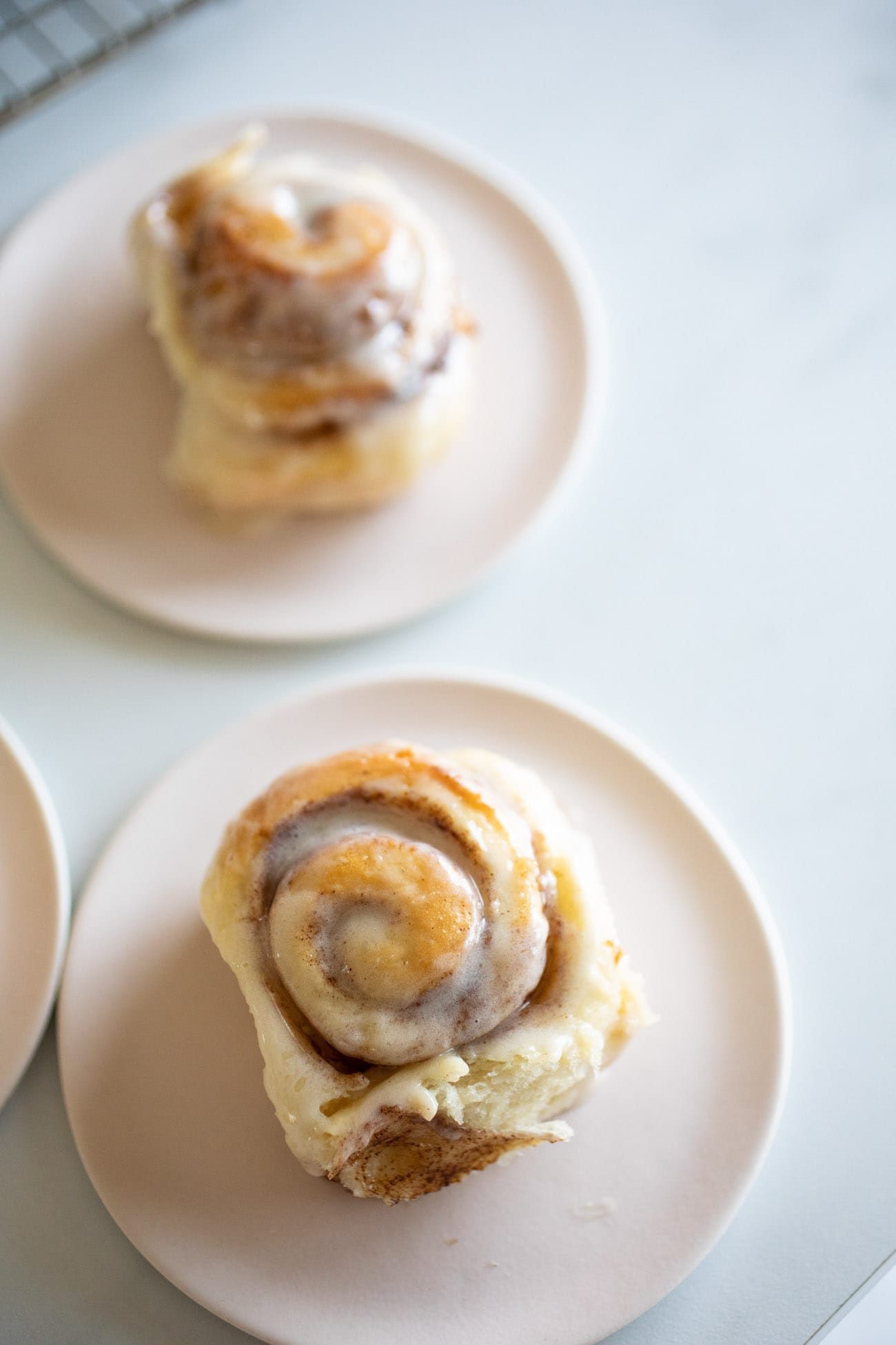 mini cinnamon rolls on pink plates