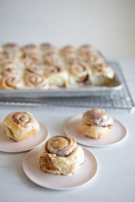 mini cinnamon rolls on pink plates