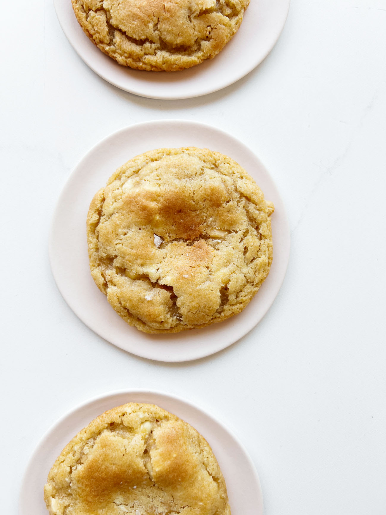 white chocolate macadamia nut cookies on plates